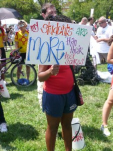 Student holding sign